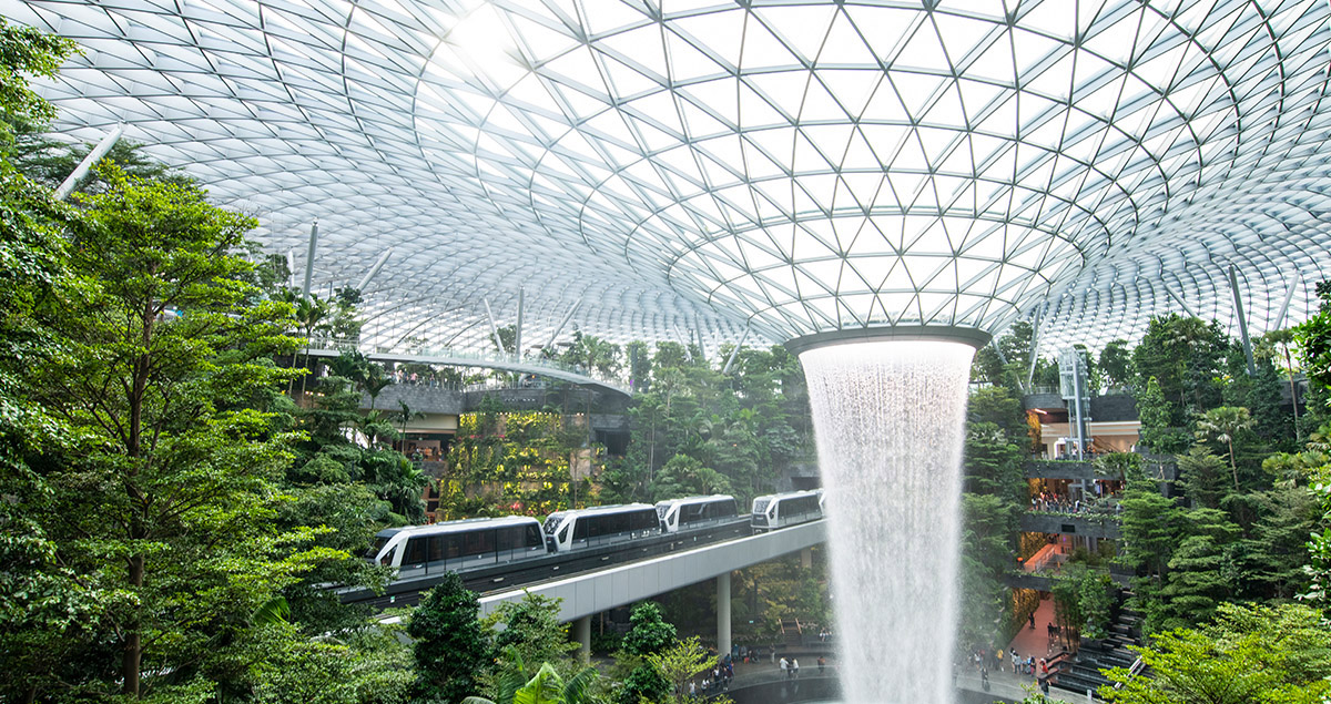 Skytrain in Changi Airport with ornate ceiling